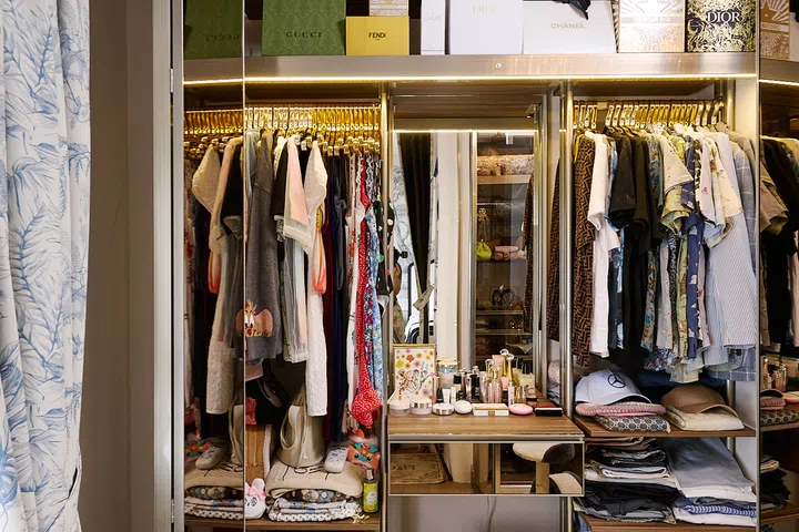 Mirrored panels and warm lighting frame a dedicated dressing station.