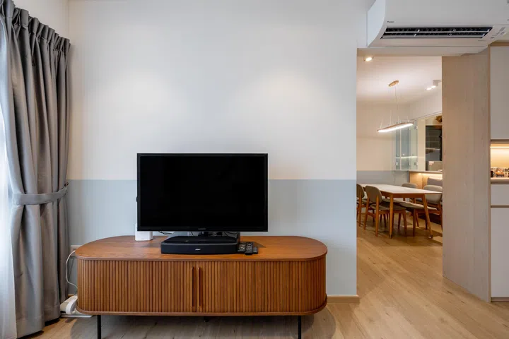 A simple TV console set up in Mr and Mrs Chua’s 4-room BTO in Tampines.