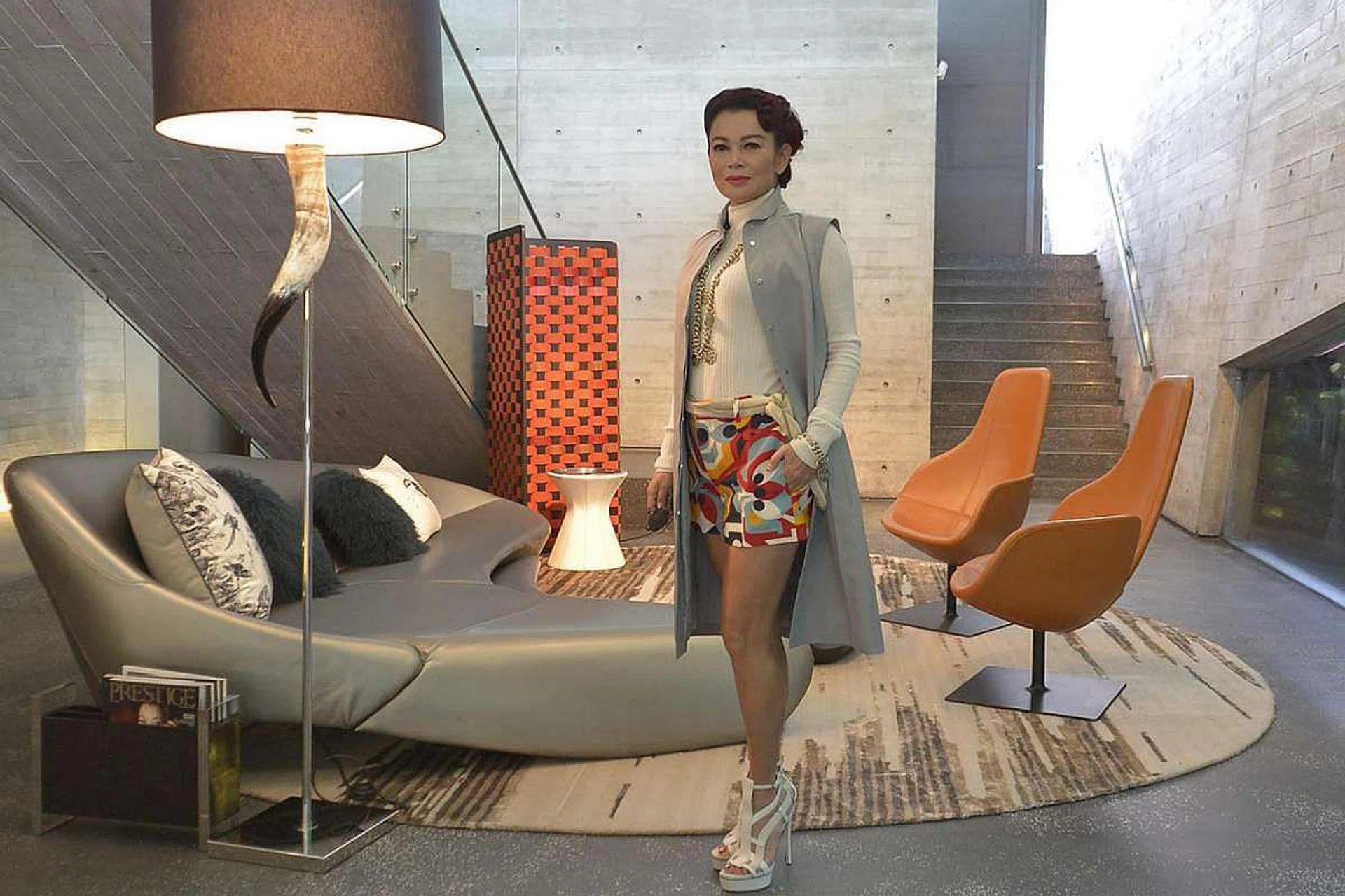 Socialite Susanna Kang poses for a photograph in the living room of her Sentosa Cove home.