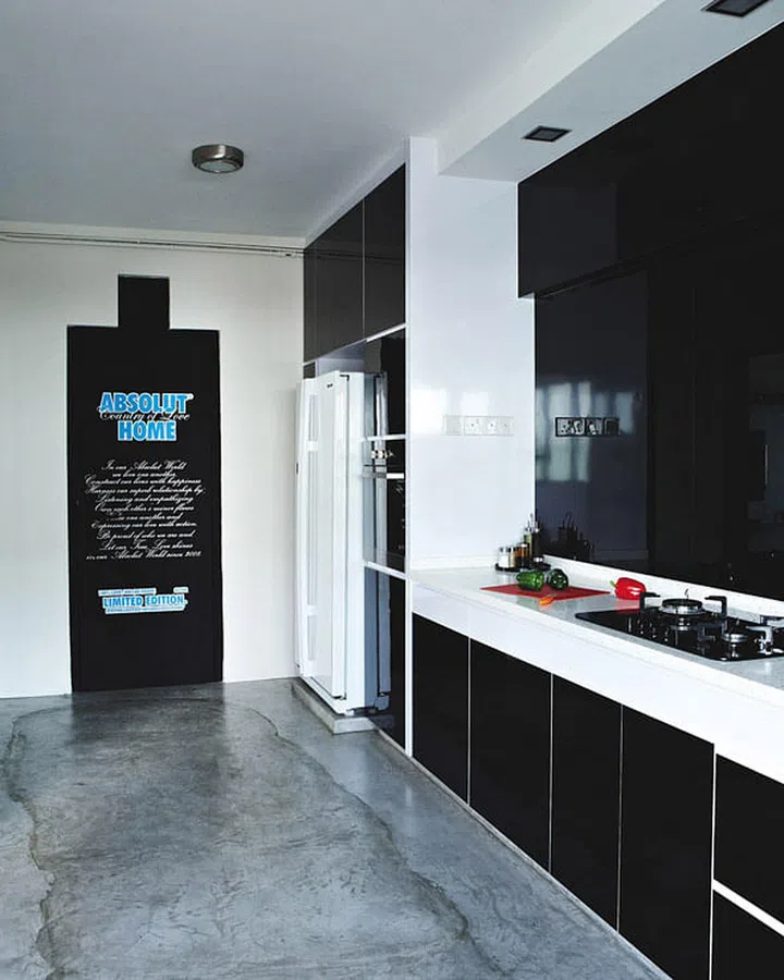 The household shelter door (and ventilation hole above) had the right proportions for the likeness of an Absolut bottle. Homeowner, Joe, designed the giant decal himself.