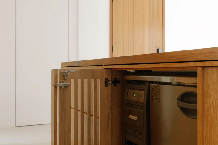 The island also conceals a commercial under-counter chiller for beers and spirits.