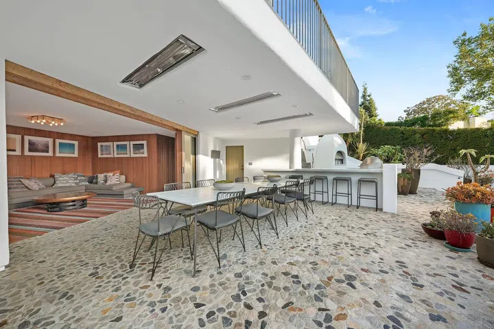 Multiple lounging areas offer ample space for entertaining.