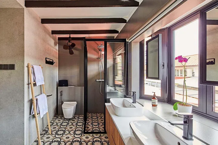 The original bathroom was too small, the homeowners enlarged it to include room for his-and- hers sinks and a wide dressing area.