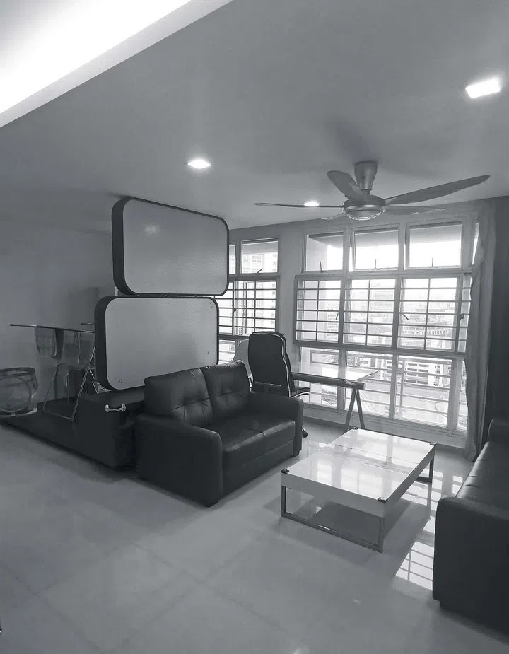 A cluttered living room with glossy tiles