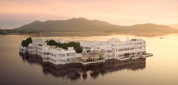 Aerial view of a lake surrounding the Taj Lake Palace Hotel