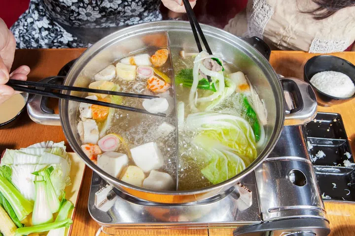 Two women prepared japanese food at restaurant with hotpot steamboat. Photo 123RF