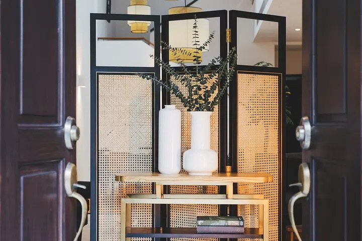 A modern black rattan screen.