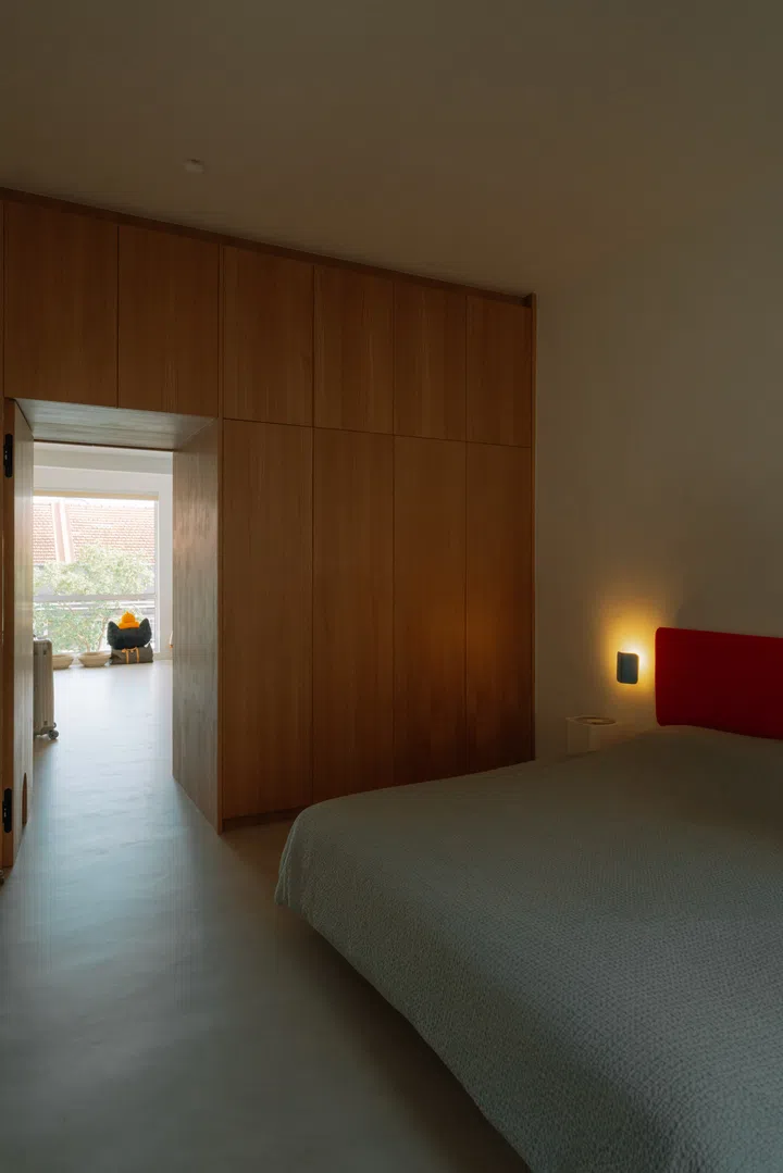 Once envisioned as a three-bedroom apartment, the home now revolves around a generously proportioned master suite connected to the walk-in wardrobe.