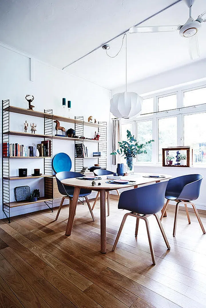 The Scandinavian influence is apparent in the home’s color palette, which leans heavily on whites, grays, and natural wood tones