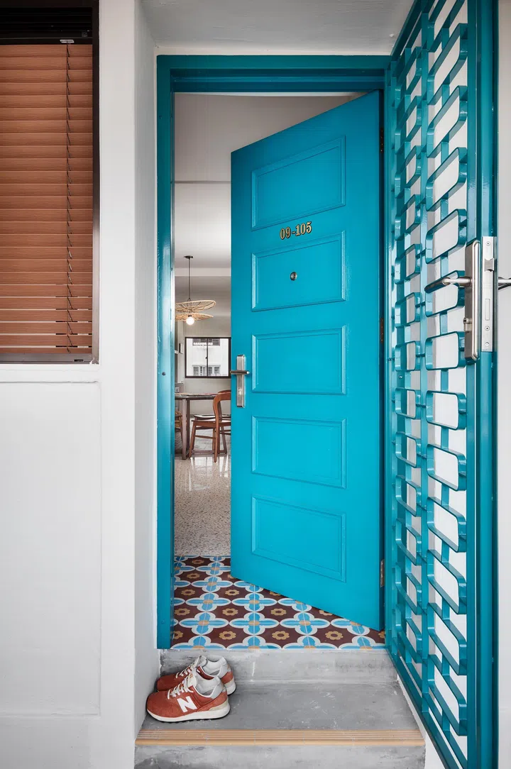 The entrance sets the tone with hand-painted details and a custom gate, reflecting the home’s emphasis on craft and personal expression.