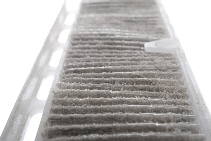 Closeup very dirty air conditioner filter.