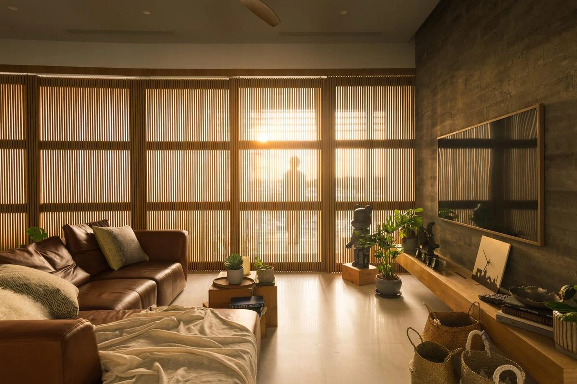 Sunset view in the living room of a 1,900 sq ft 3-bedroom condominium in Sentosa for a young couple and their two cats.
