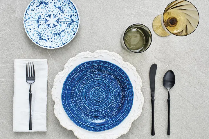 Wazan Japan carousel collection salad plate, $28.90; Victorian white plate, $20.90; Blue salad plate, $15.90; Matt black cutlery, $10.90 each, all from Lovera Collections.