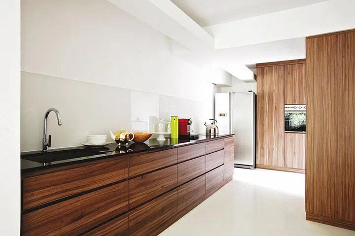 The open-concept kitchen flows into the dining room and is the first thing visitors see.