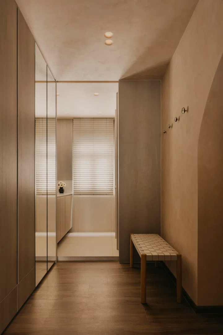 The entire walk-in closet features custom carpentry. 