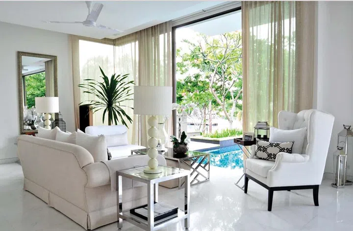 BEFORE: What used to be an underutilised sitting room is now a vibrant dining area that can seat up to eight. The floral elements on the backwall and furniture stand out beautifully against the white floor.