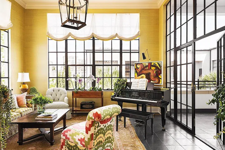 Walls in grass cloth by Innovations in Wallcoverings. Lantern by Formations. Rug, Antique Oushak. Custom Window treatments in Holland & Sherry. Slipper Chair covered in Schumacher fabric.