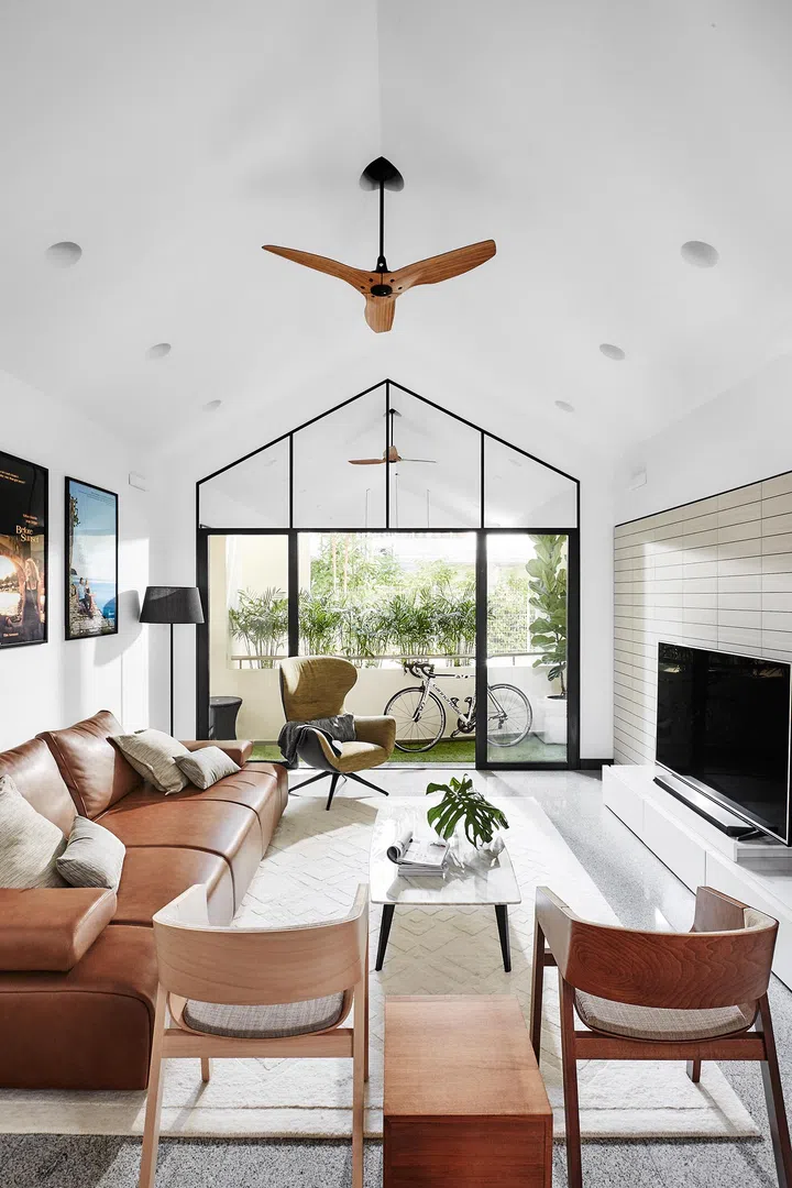 Living room and balcony in a 3-bedroom condominium in East Coast.