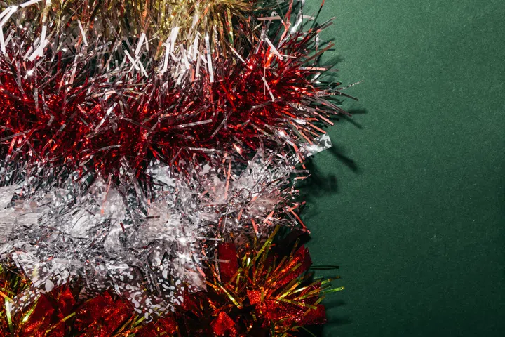 Texture background of flat lay christmas colorful tinsel.
