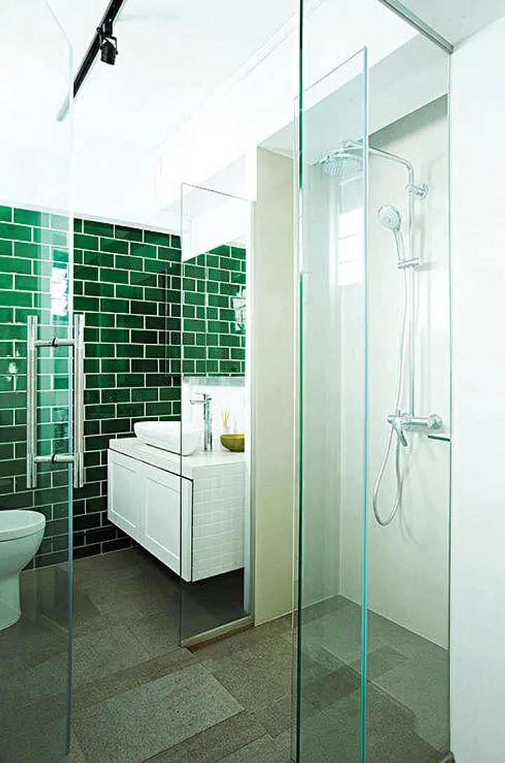 The interior designer refurbished the toilet and turned it into an elegant en suite bathroom.
