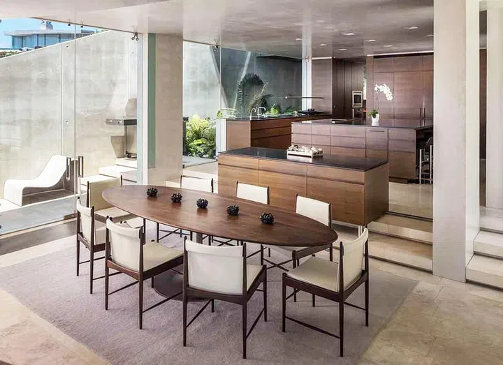 Industrial style kitchen and dining room in Alicia Key's sleek, mountaintop mansion. Image by Truila