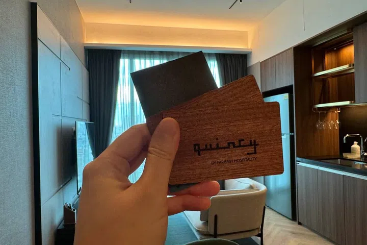 A set of 2 wooden key cards at Quincy House.