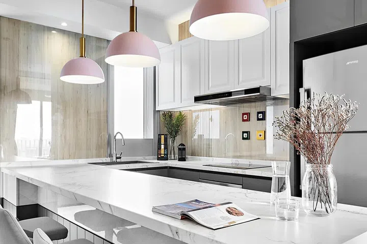 Kitchen island dining table within this condominium unit in Queens Peak.