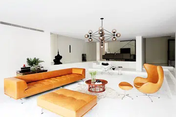 The living area is the heart of the home, flanked by bedrooms, the kitchen and a television zone on top of the steps. Removing the steps' original railings results in an unobstructed open look.