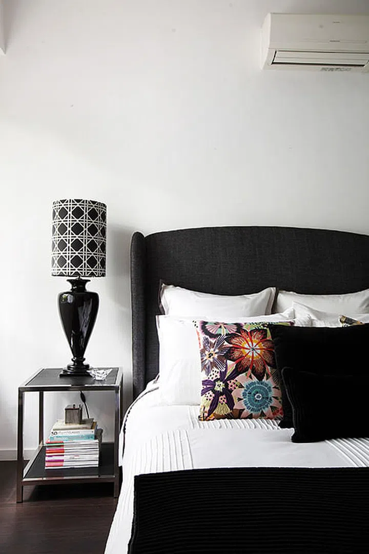 Missoni Home cushions add some colour to the black-and-white scheme of one of the guest bedrooms.