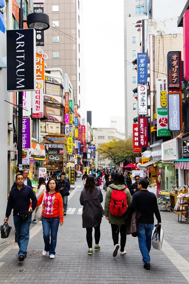 Young people shopping in the Myeongdong Shopping Street on November 1, 2014 in Seoul, South Korea. The location is the premiere district for shopping in the city. Photo 123RF
