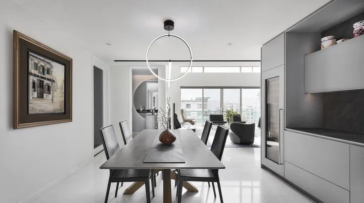 Bright and white dining room in this 2-storey penthouse in Bukit Timah.