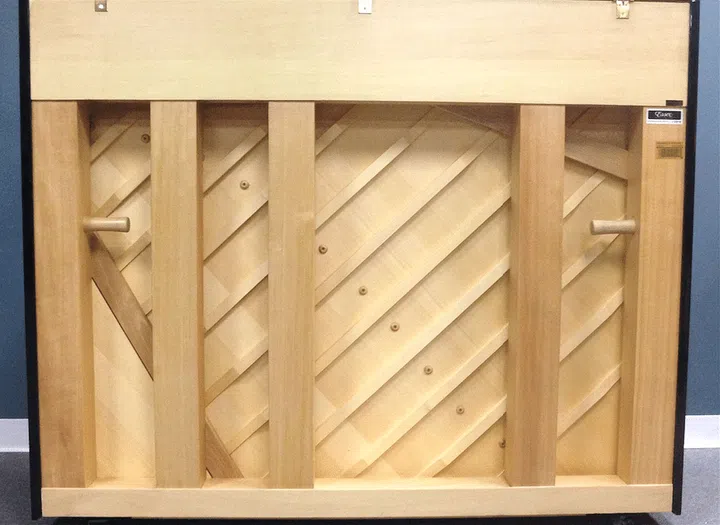 A quality upright piano would have a five-post asymmetric and unevenly spaced back frame, which serves as support against approximately 20 tonnes of cumulative string tension.