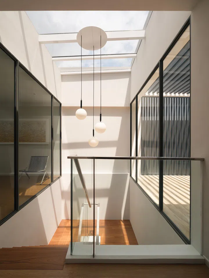 A skylight choreographs shifting light patterns.