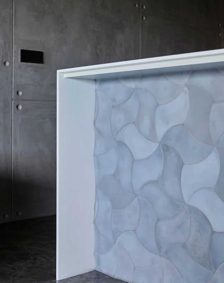 Textures and forms clad the kitchen island.