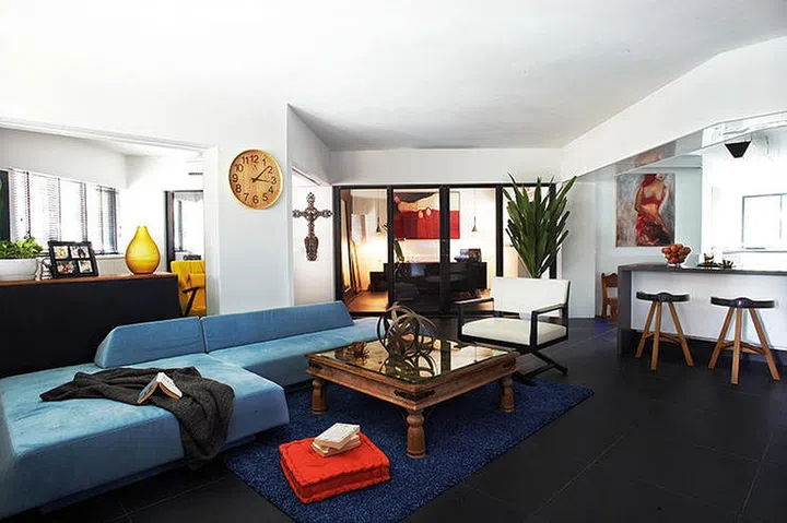 Walls were done away with between the living area and the kitchen, making it a large, open space.