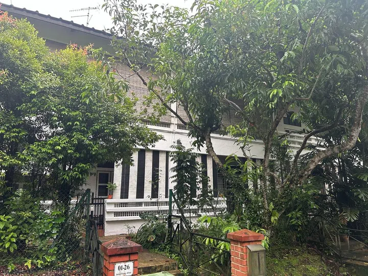The front entrance of a terrace house along Jalan Hang Jebat, with its iconic black-and-white outdoor blinds indicative of SLA Colonial housing.