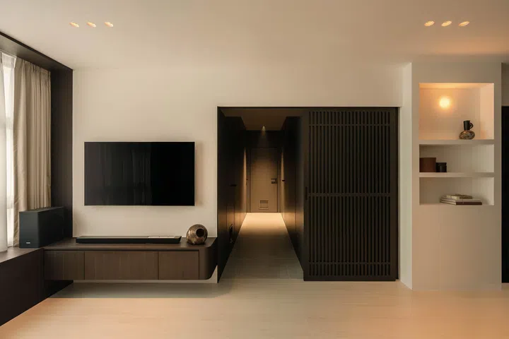  When opened, the corridor reveals a darker palette that creates a calm, Zen-like transition between rooms.
