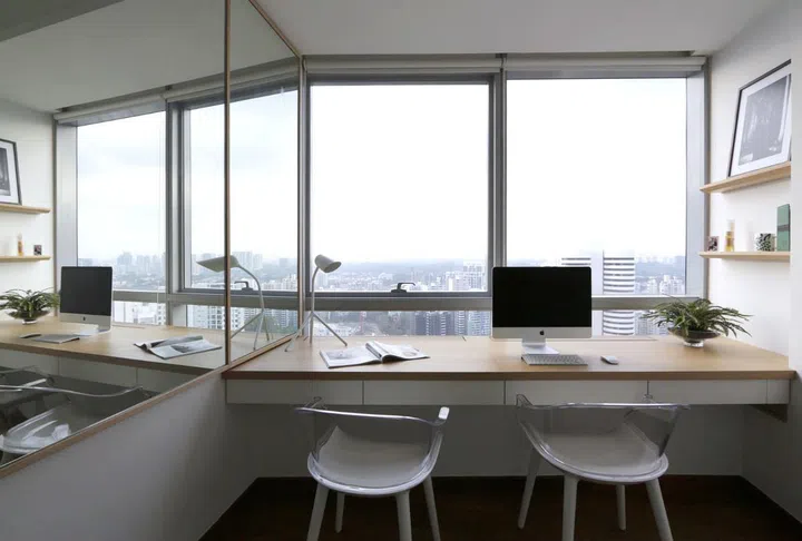 In this condominium unit at Arc@Draycott, the bay window space was transformed into a work study table desk.