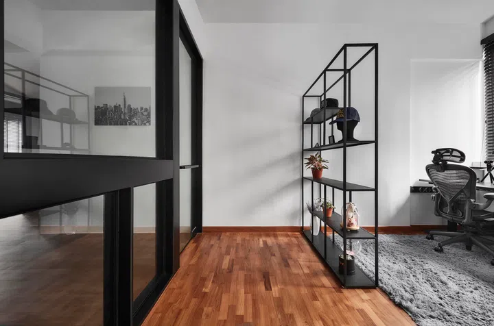 The study is pared down to essentials: a desk for work and a clean, structured background.