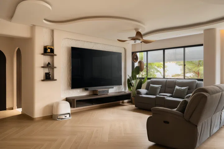 The living room’s sculptural ceiling and hand-finished TV feature wall demonstrate the craftsmanship that first convinced Amir and Ayu they had found the right designer.
