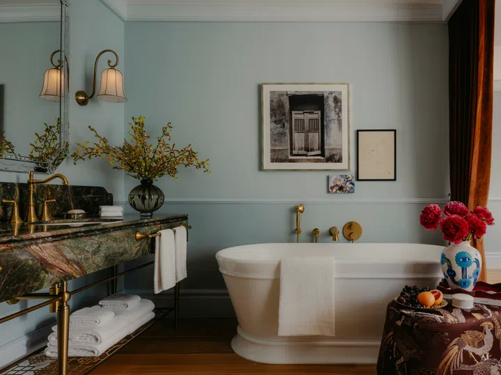 Heritage colour palettes in the rooms of NoMad Hilton Singapore.