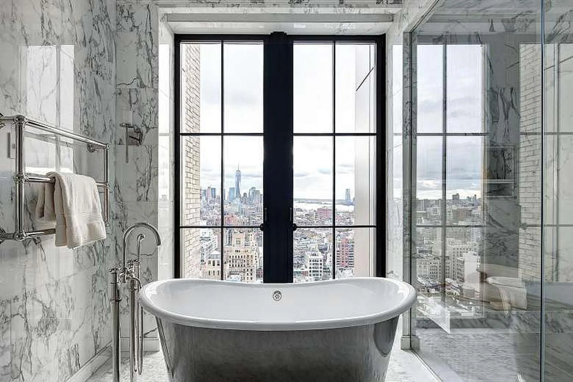 Large windows and less privacy are among the trends in bathroom design, as seen in this one in Walker Tower in New York.PHOTO: NYTIMES