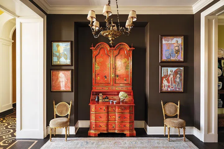 19th C. lacquered Chinoiserie Secretary. 19th C. giltwood chandelier. Pair of antique gilt chairs. Oushak Rug from Mattar.
