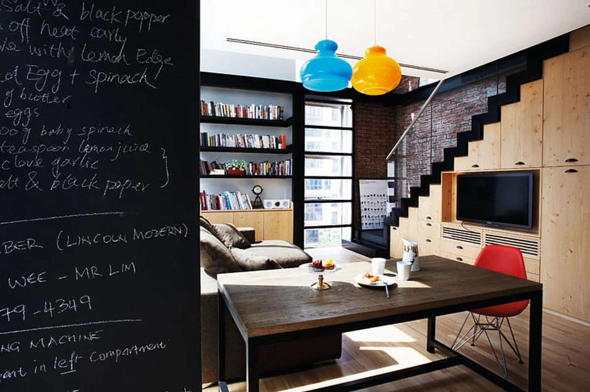 Spots of primary colours pop against the light wood and black backdrop.