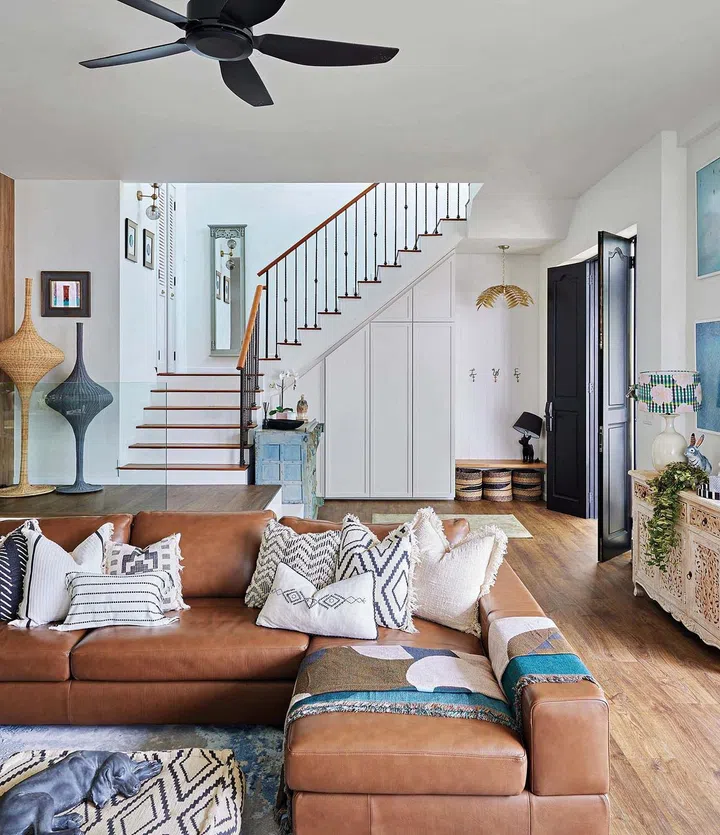 The King Living sofa, Nasser Nishaburi rug and rattan floor lamp from Beuro give the living room a laid-back quality.