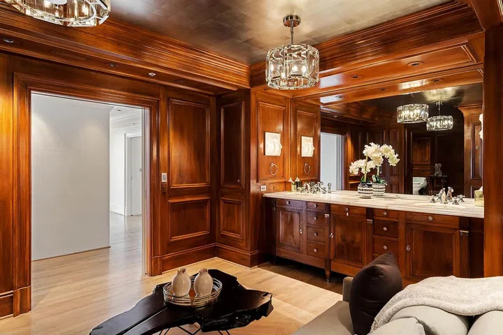 Floor-to-ceiling wood walls provide a classy aesthetic.