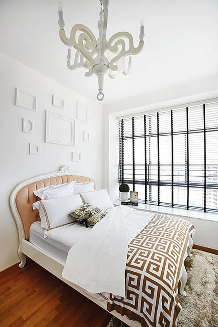 In a rather abstract interpretation of classical interiors, this space features a peculiar chandelier and photo frames (sans photos as the homeowners felt that a collage of images would take away the serenity of this space). 