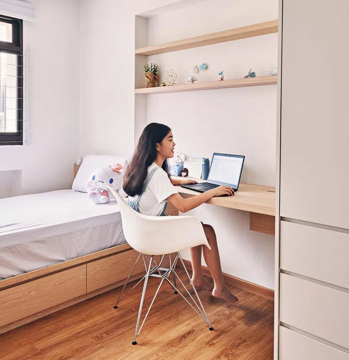 Kylia's room has similar storage platform and open shelves above her study for her knick-knacks collection.