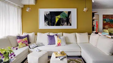 This 1,700 sqf, four-bedroom condo apartment in Robertson Quay has a canvas of neutral tones such as whites and creams, punctuated with bright, refreshing colours in the form of patterned material finishes on the soft furnishings, as well as art pieces