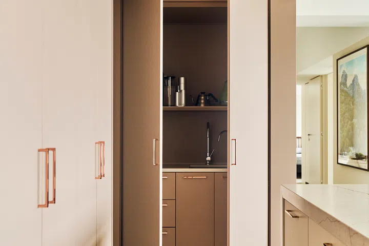 A concealed pantry in the dry kitchen.